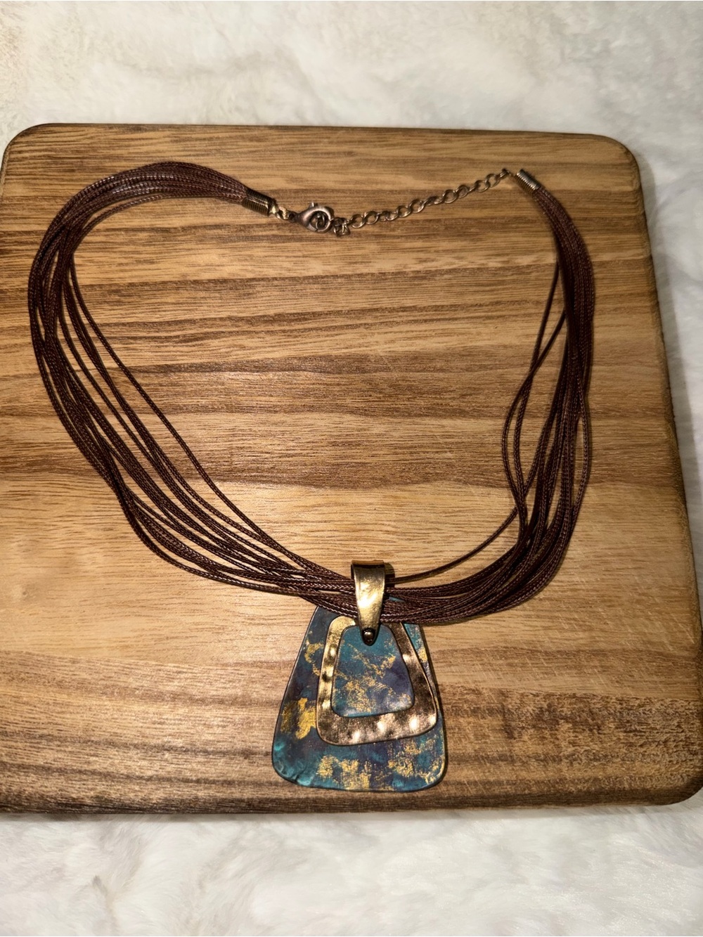 Multi-Strand Brown Necklace with Blue-Gold Pendant